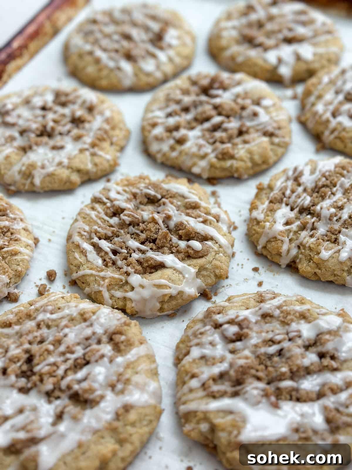 A side view of coffee cake cookies on a baking sheet.