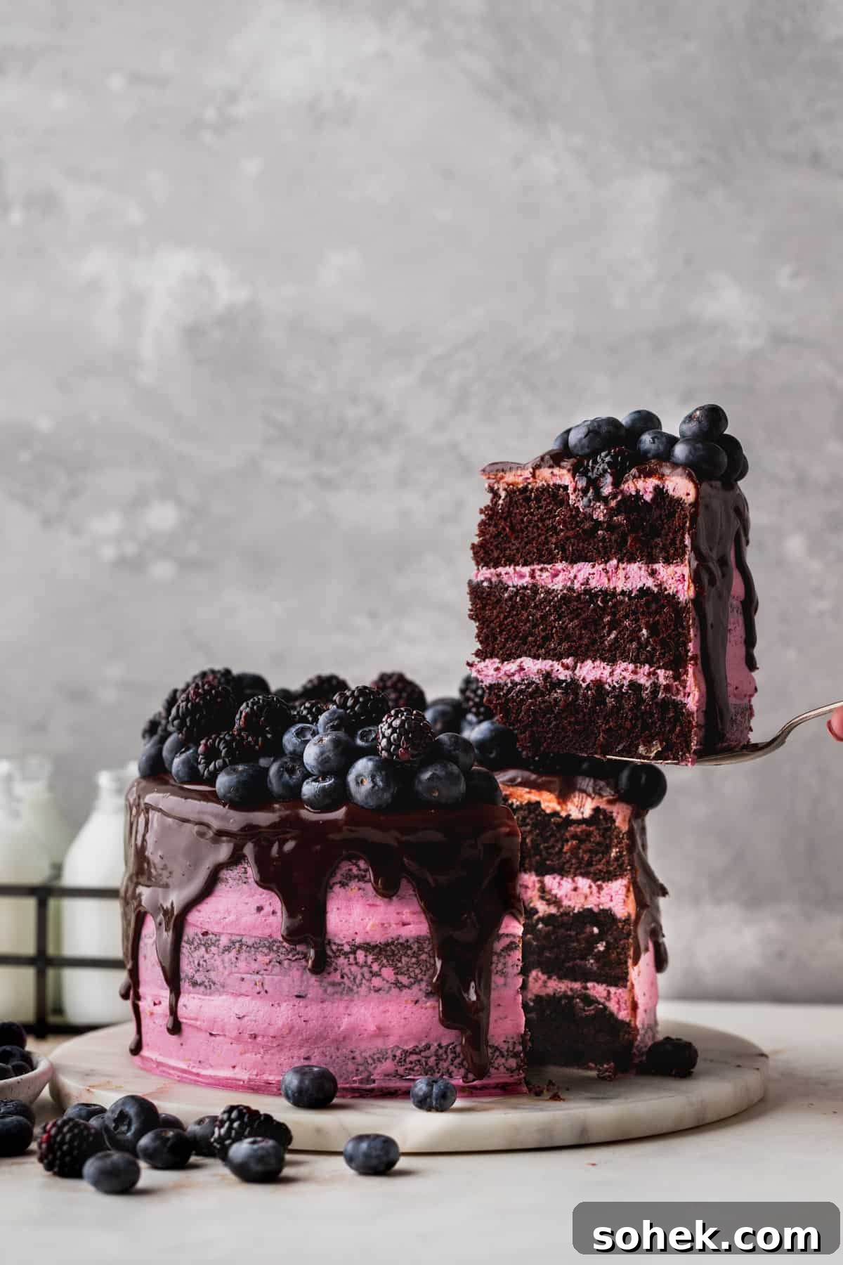 Pulling a slice out of cake.