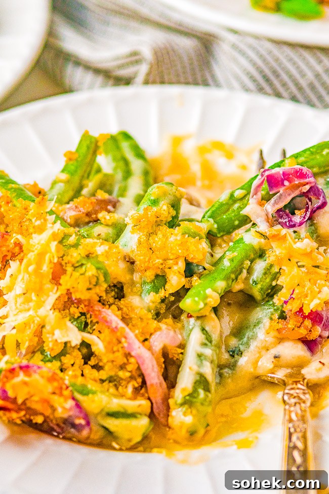 Classic Green Bean Casserole Recipe for Holiday Dinner 12 A serving of green bean casserole on a white plate.