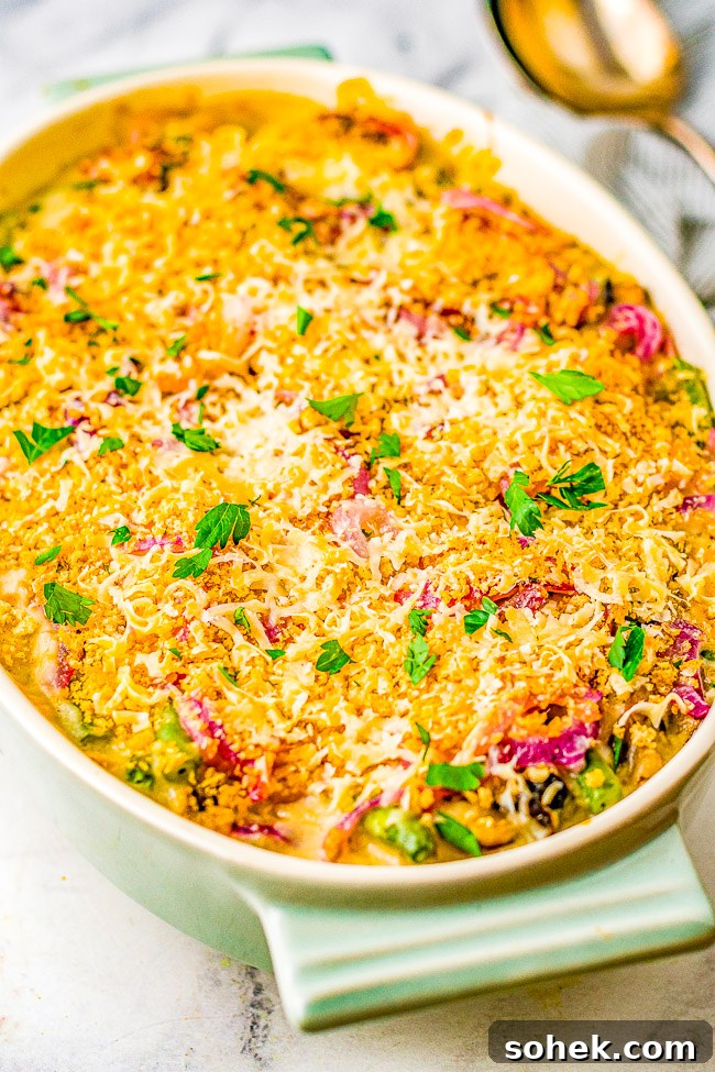 Classic Green Bean Casserole Recipe for Holiday Dinner 8 A green casserole dish full of baked green bean casserole.