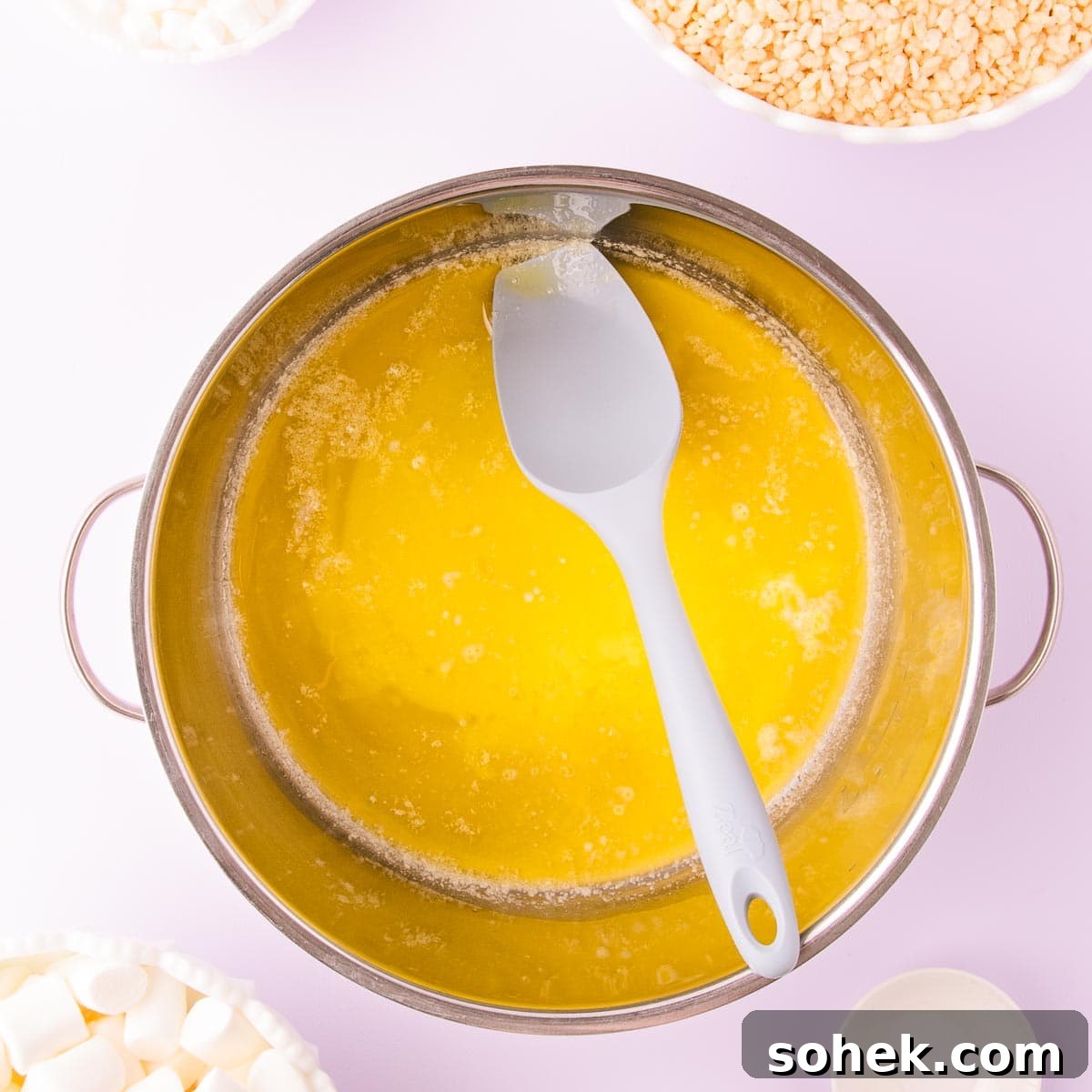 Gluten-Free Rice Krispie Treats Recipe — Crispy & Chewy Bars 5 Melted butter in a very large stainless steel saucepan.