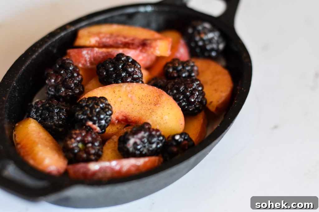 Peach and Blackberry Crisp for Two — Quick Summer Dessert 3 Fruit filling in cast-iron pan