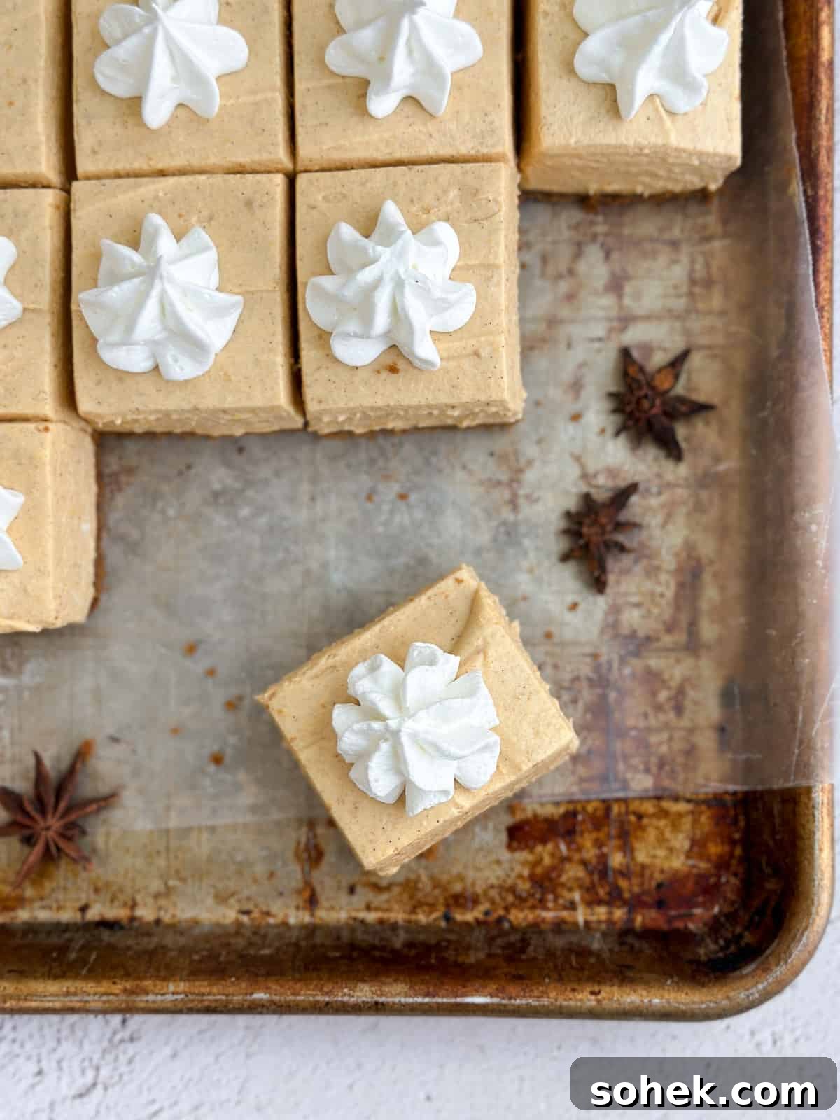 No-Bake Pumpkin Cheesecake Bars — Creamy Fall Dessert Recipe 14 a square of the no bake pumpkin cheesecake bars.