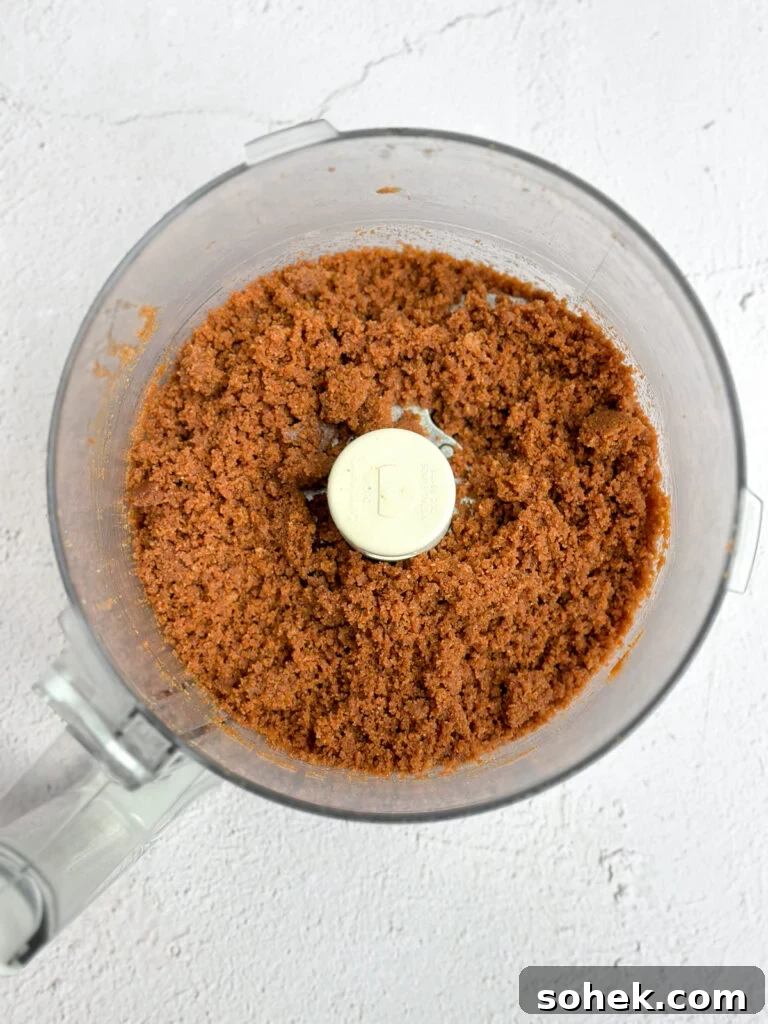 No-Bake Pumpkin Cheesecake Bars — Creamy Fall Dessert Recipe 5 Biscoff cookie crumbs in food processor.