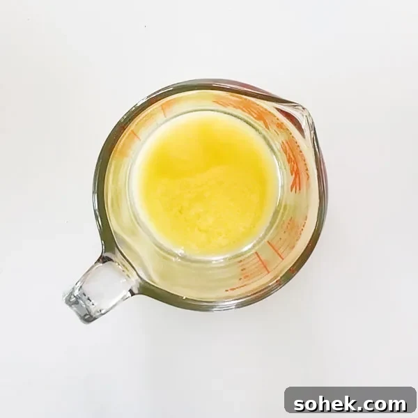 Melted butter in a glass measuring bowl.