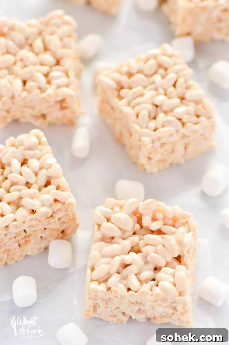 Classic Gluten-Free Rice Krispies Treats Recipe for Crispy Marshmallow Bars 3 Delicious homemade gluten free rice krispies with marshmallows scattered