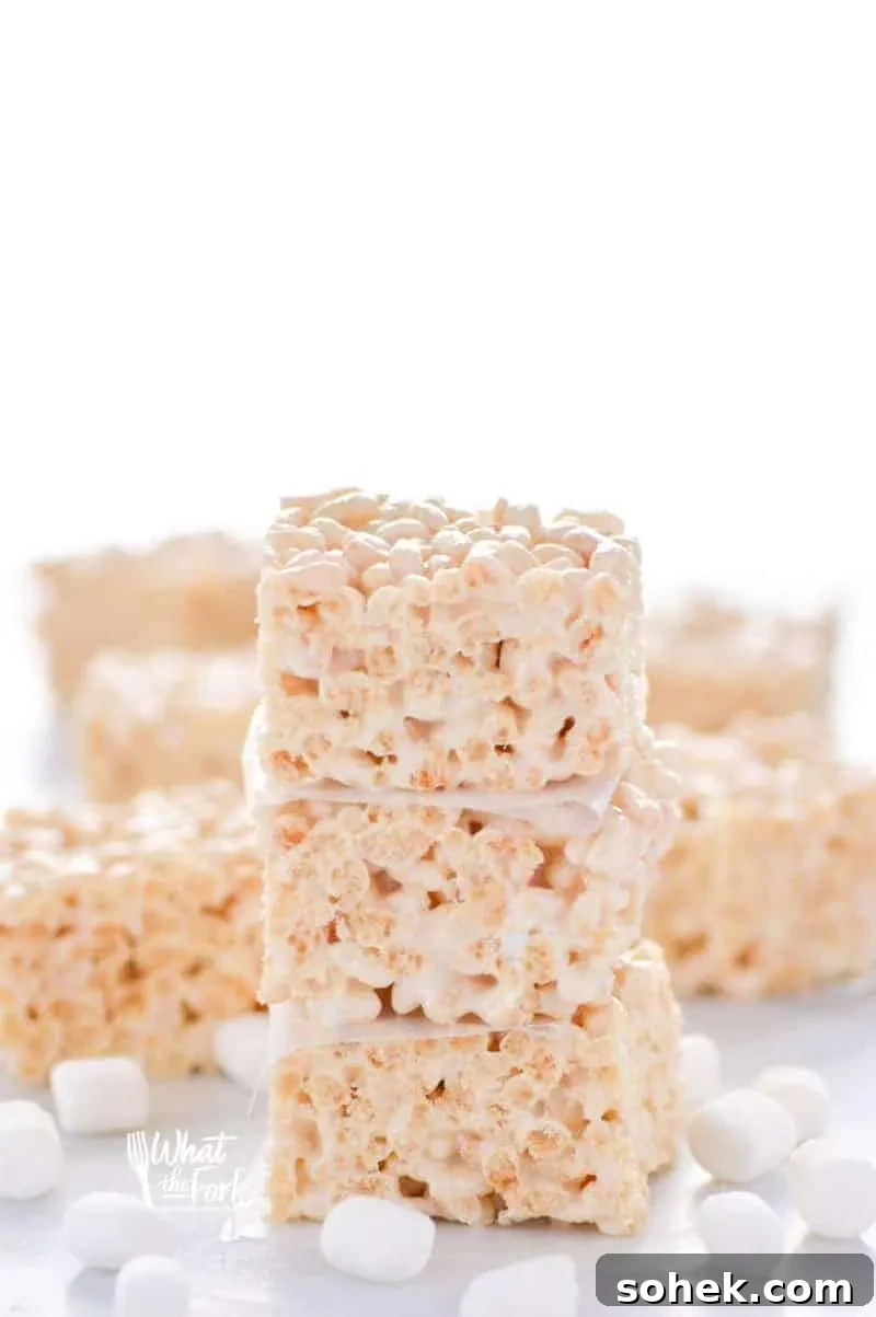 Classic Gluten-Free Rice Krispies Treats Recipe for Crispy Marshmallow Bars 5 Stack of three gluten free rice krispies made from scratch