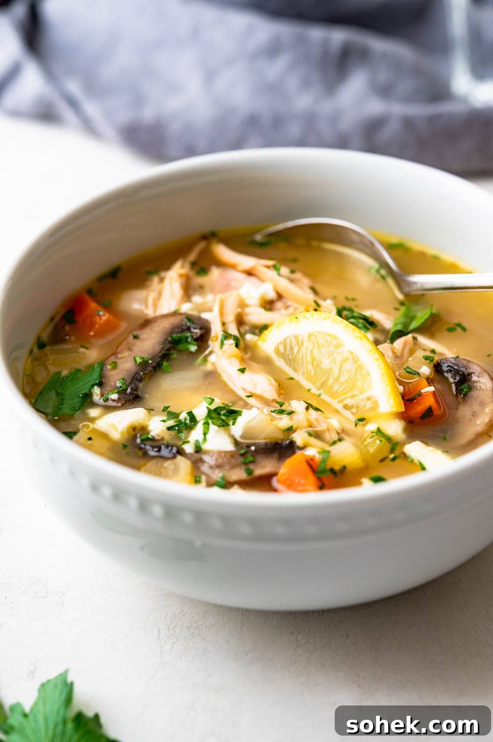 a bowl of greek chicken soup with leftover rotisserie chicken.