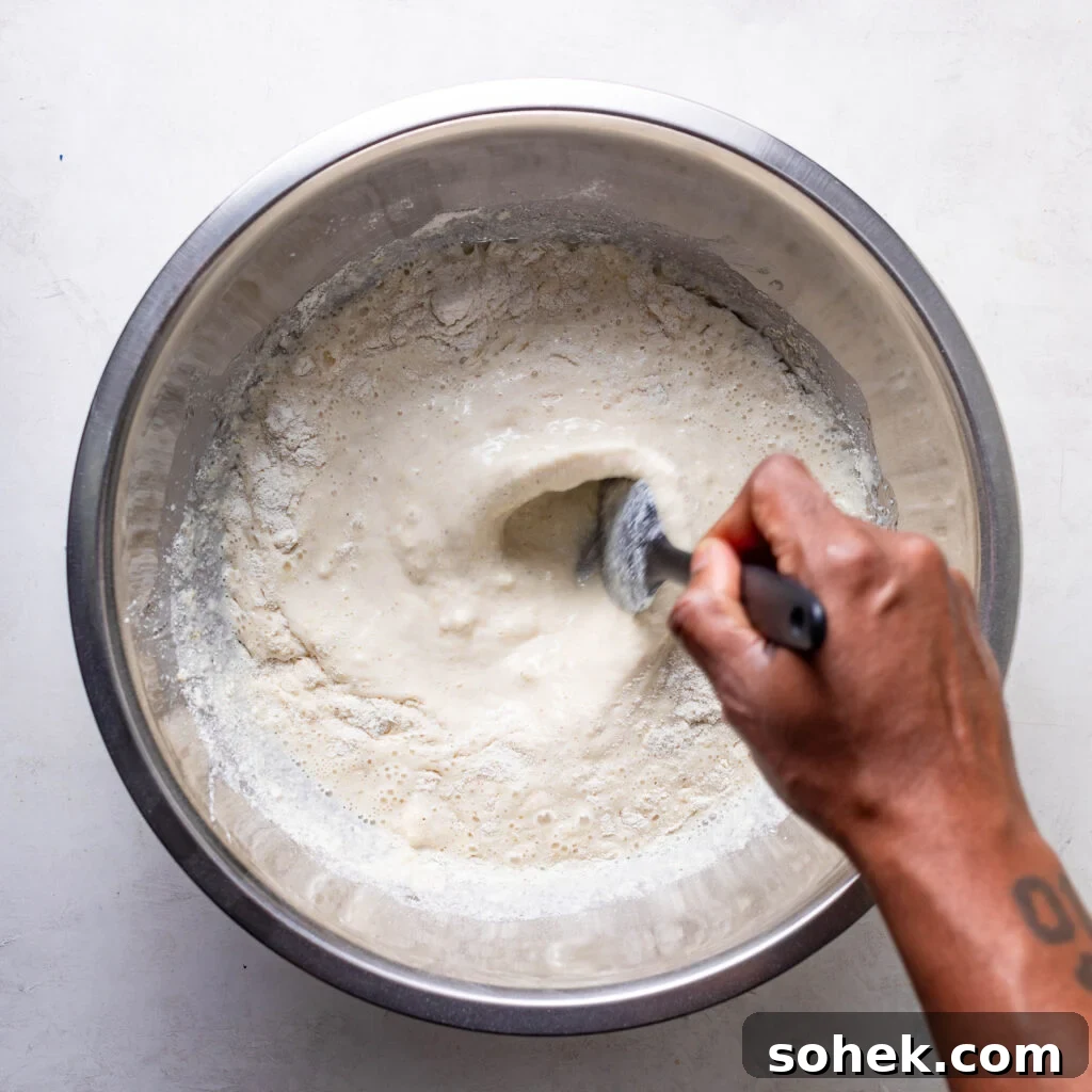 stirring buttermilk, oil,  eggs, and cornmeal 
