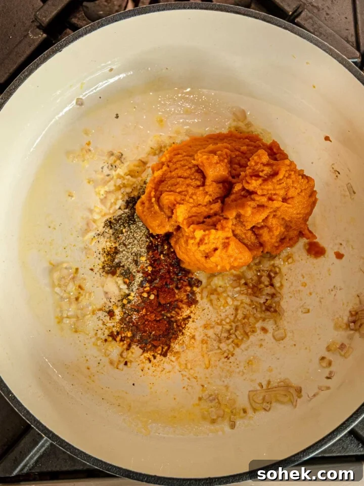 Creamy Pumpkin Pasta Sauce Recipe: Vegan, Savory Fall Dinner 5 Pumpkin puree with paprika, black pepper, and red pepper flakes added to sautéed shallots and garlic.