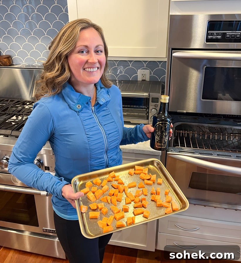 Lately Loving: Favorite Finds and Must-Have Picks This Month 11 anne mauney holding a sheet pan of sweet potatoes and a bottle of olive oil