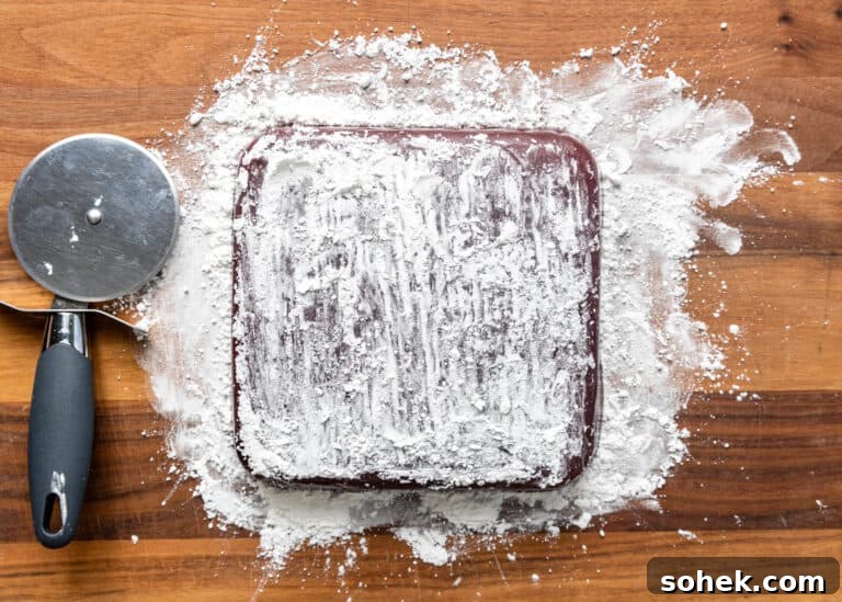 Authentic Turkish Delight (Lokum) Recipe for Soft, Chewy Sweets 18 overturned turkish delight dusted with powdered sugar