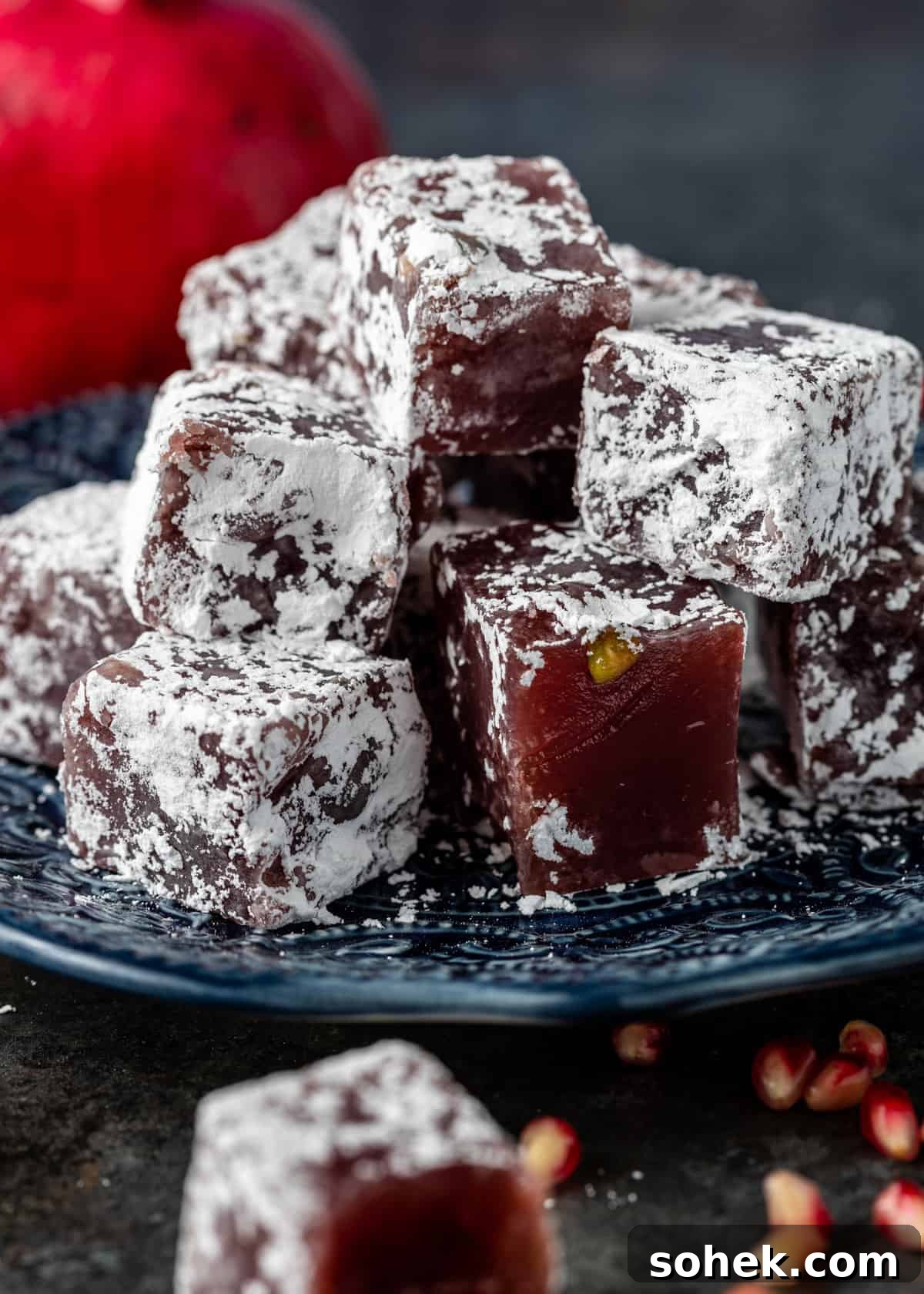 Authentic Turkish Delight (Lokum) Recipe for Soft, Chewy Sweets 21 closeup: cubes of turkish delight candy on blue plate