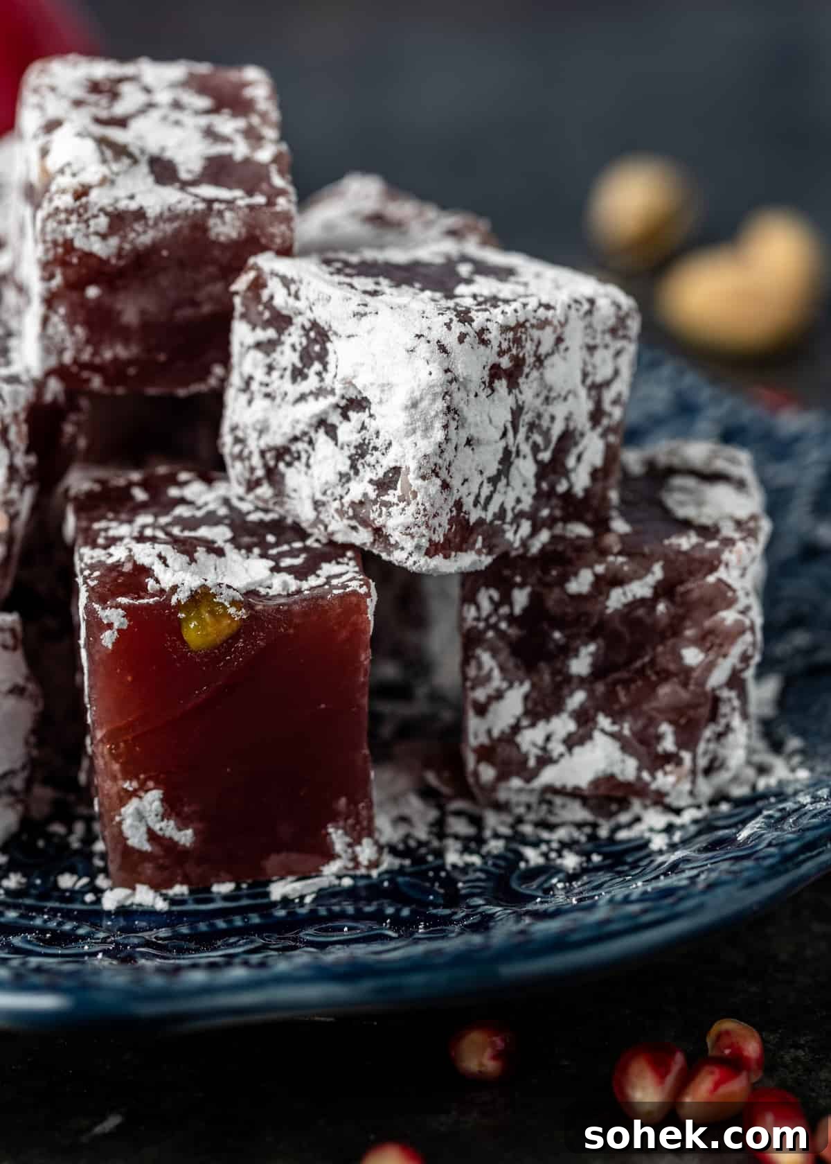 Authentic Turkish Delight (Lokum) Recipe for Soft, Chewy Sweets 4 squares of homemade gelatin candy (called lokum) on glass plate