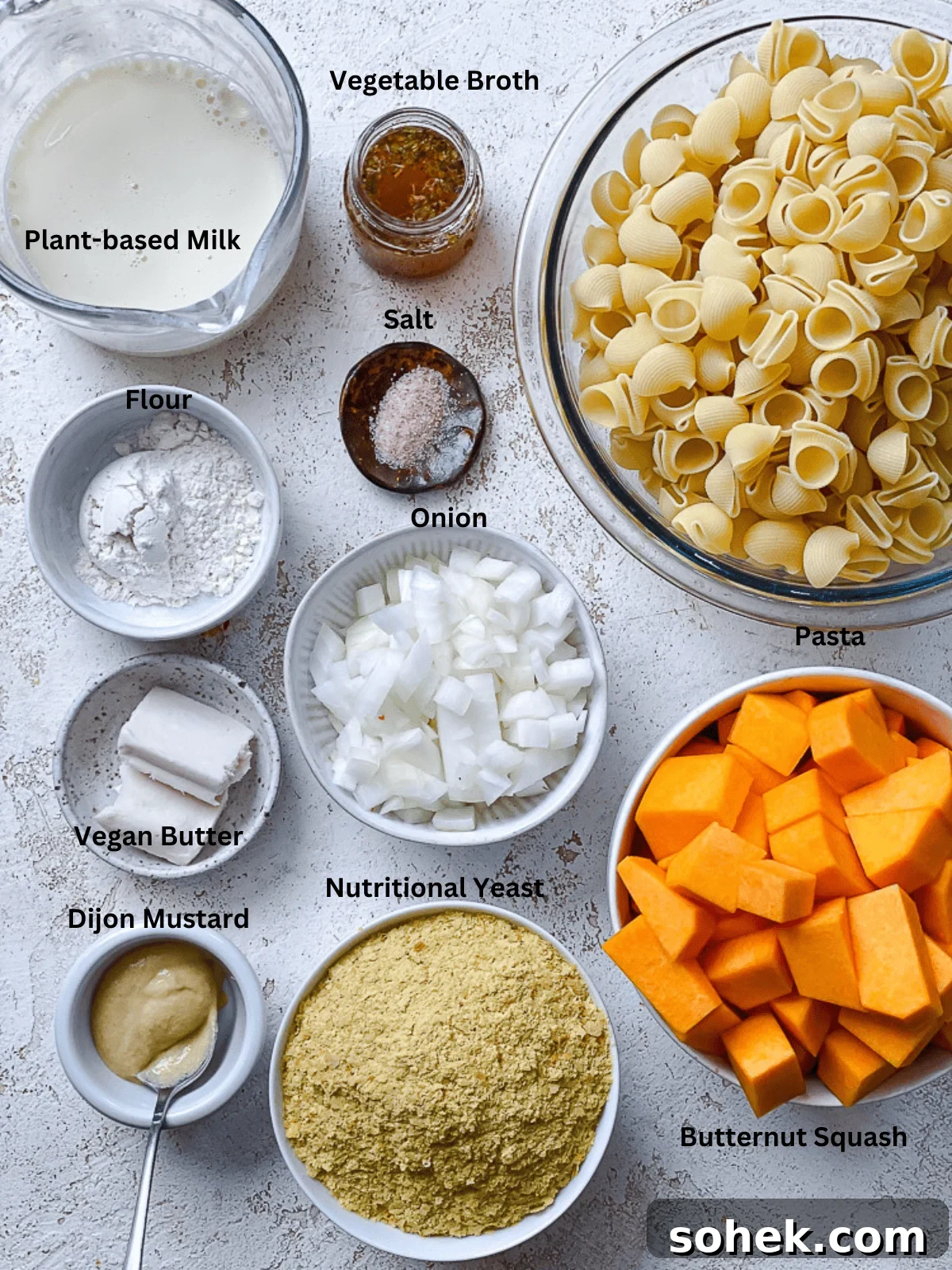 Creamy Butternut Squash Macaroni and Cheese Recipe 3 ingredients for Butternut Squash Mac and Cheese measured out on a white surface