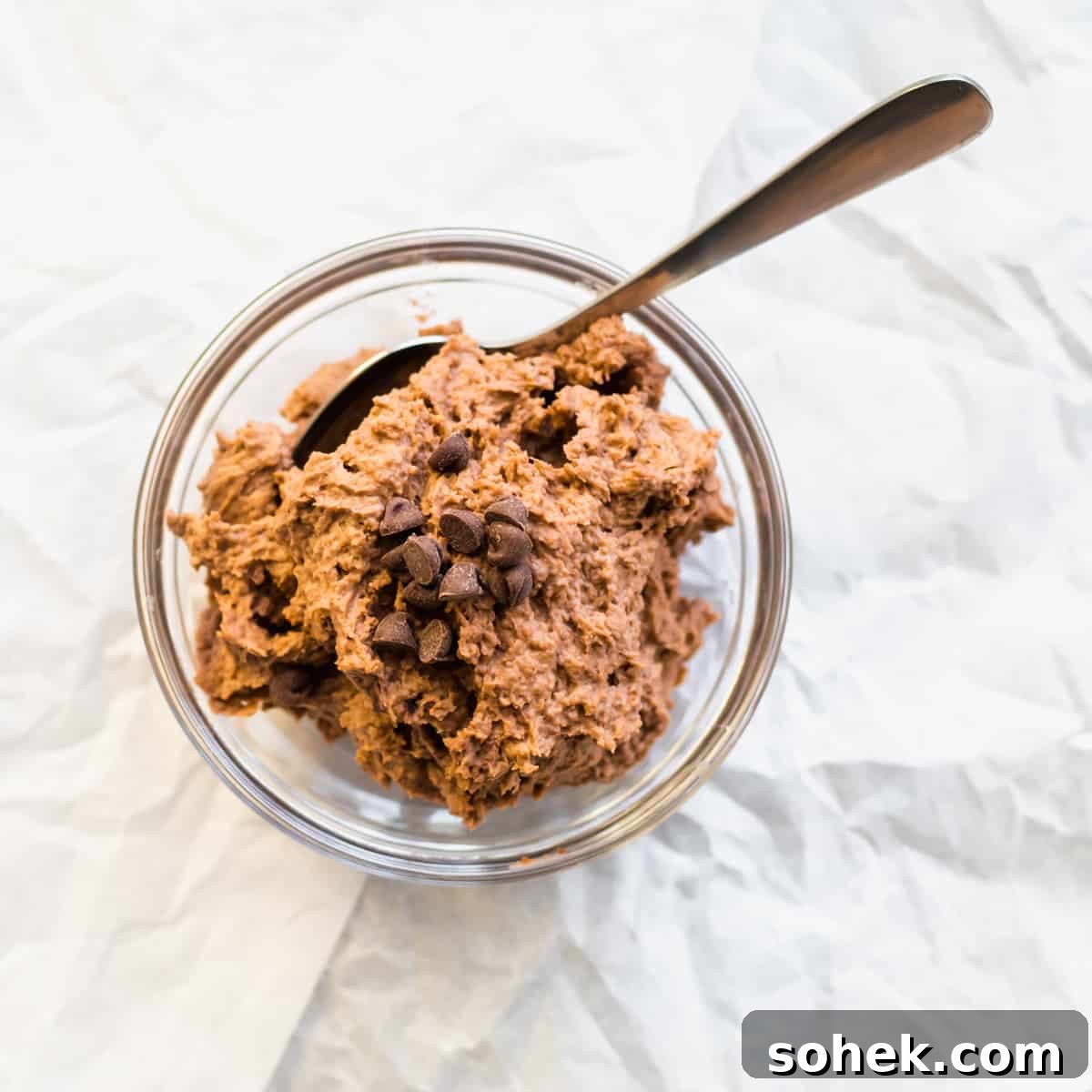 chocolate mousse in a mason jar with a spoon.