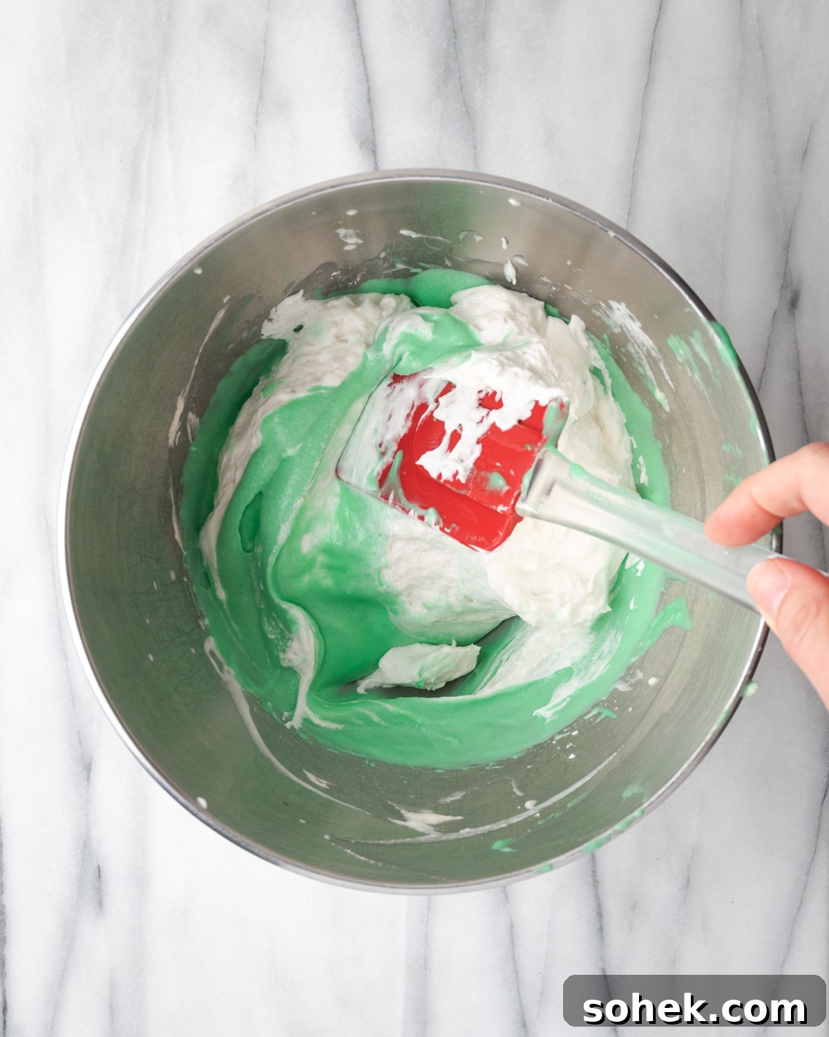 No-Bake Chocolate Mint Pie Recipe: Creamy No-Bake Mint Chocolate Pie 8 Spatula folding whipped cream into green pie filling.