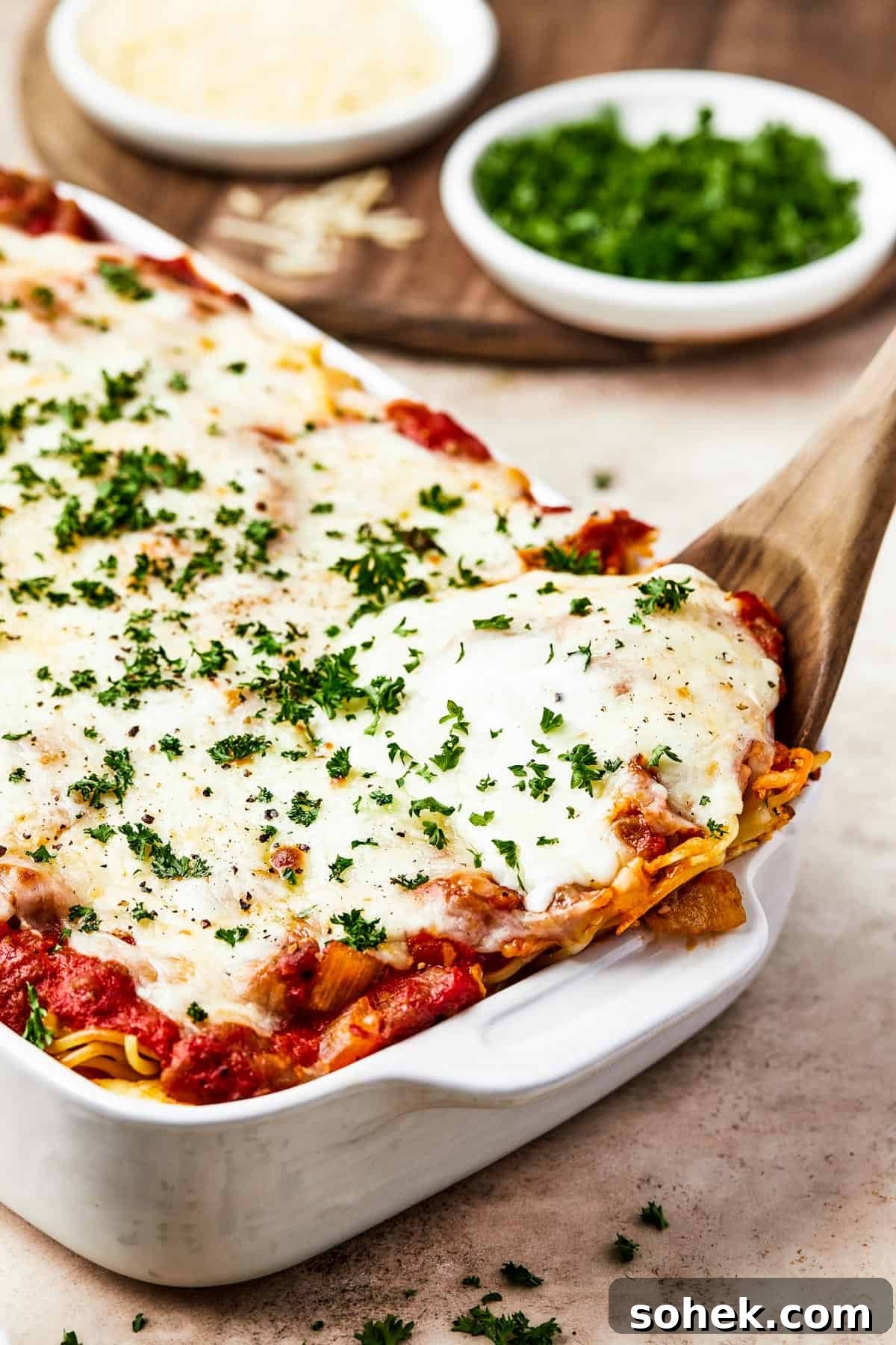 Spaghetti casserole in a white baking dish.