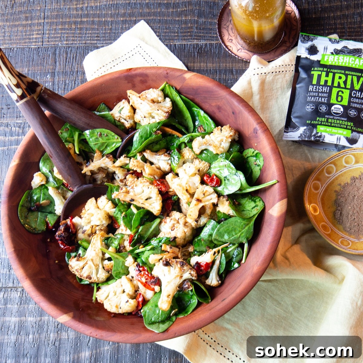 Winter salad of roasted cauliflower, mushrooms, tomatoes, and baby spinach tossed in a mushroom vinaigrette.