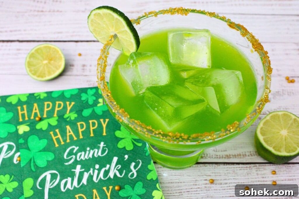 irish margarita with lime on white wooden board with st patrick's day napkin