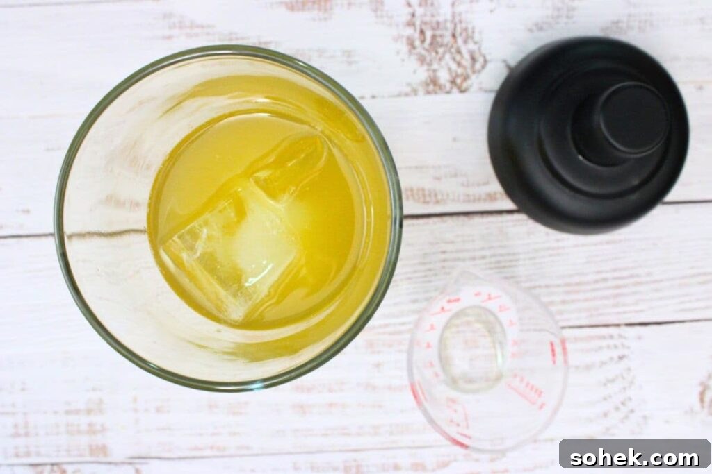 add whiskey, triple sec, lime juice, and simple syrup to cocktail shaker