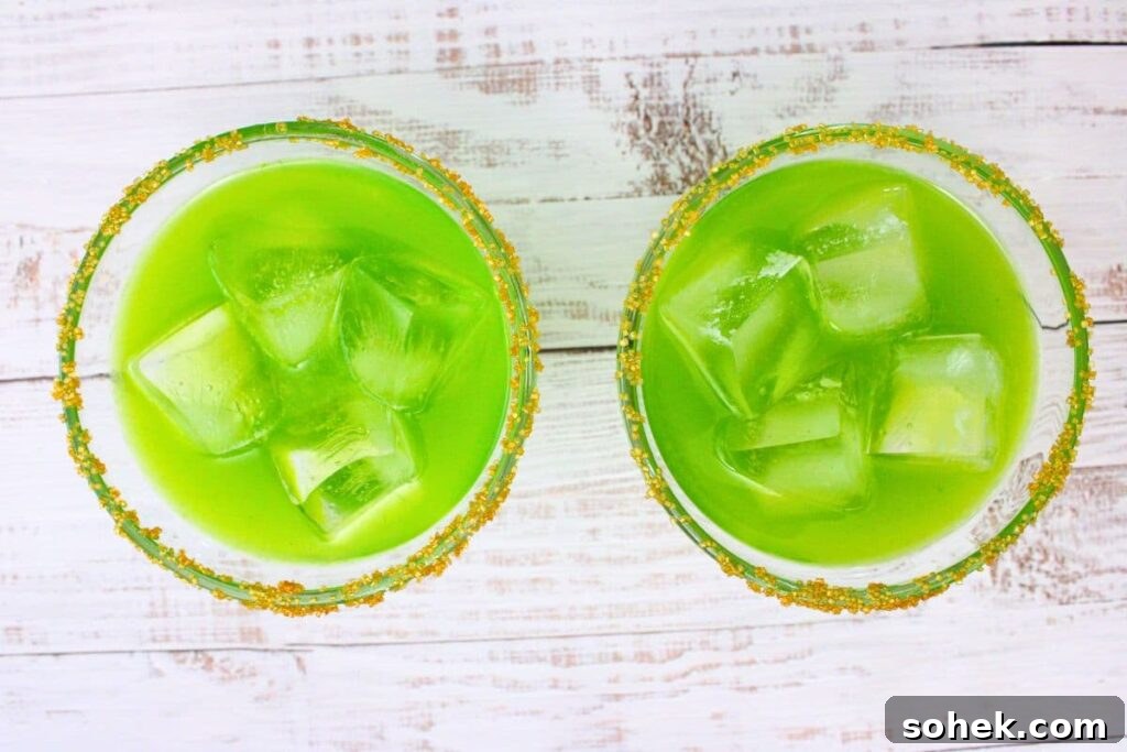 strain irish margarita into prepared glasses