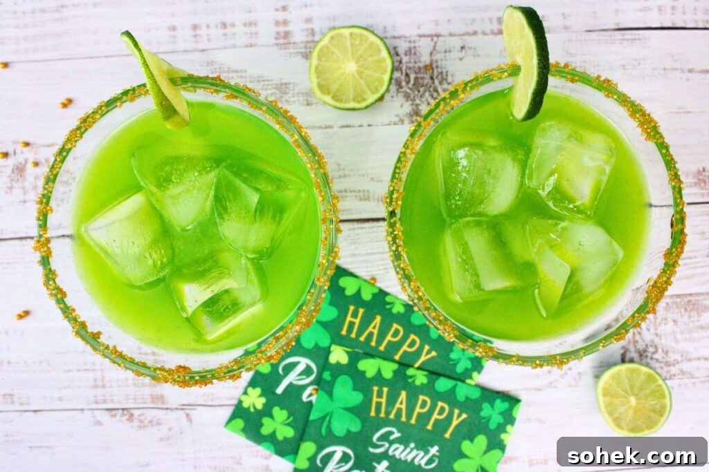 overhead view of two irish margaritas on a white wooden plank