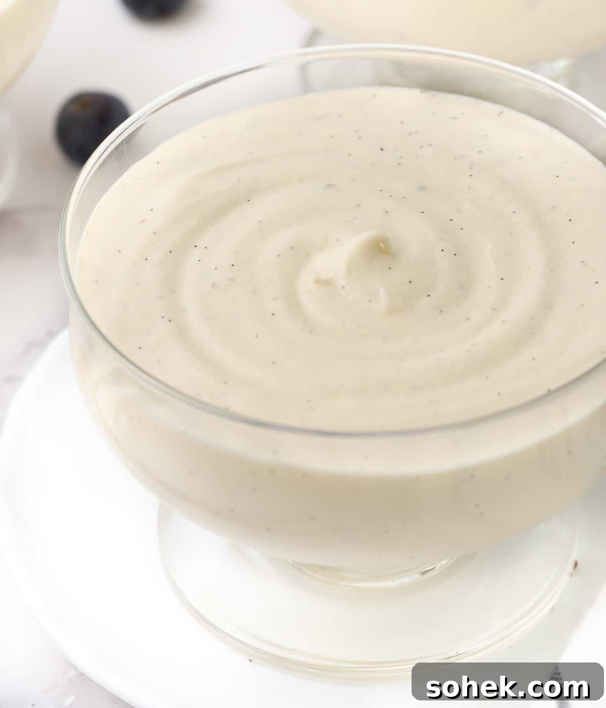 Close up on the set mousse texture inside a glass cup.
