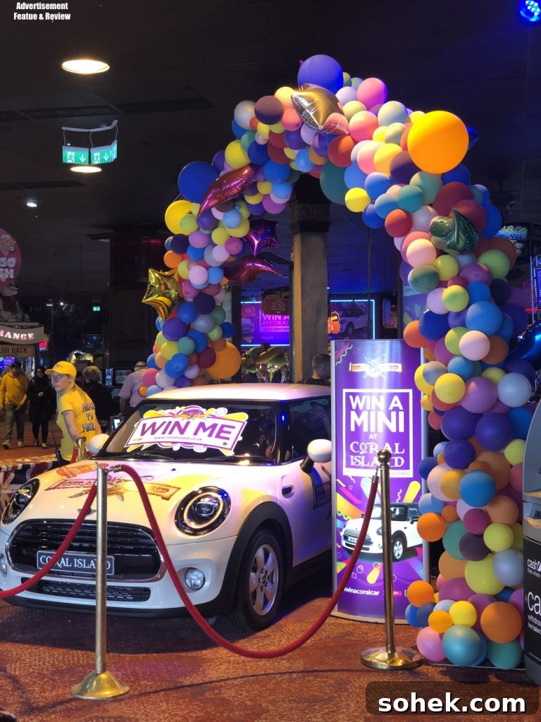 win a mini at coral island blackpool - mini car surrounded by balloons and win me signs 