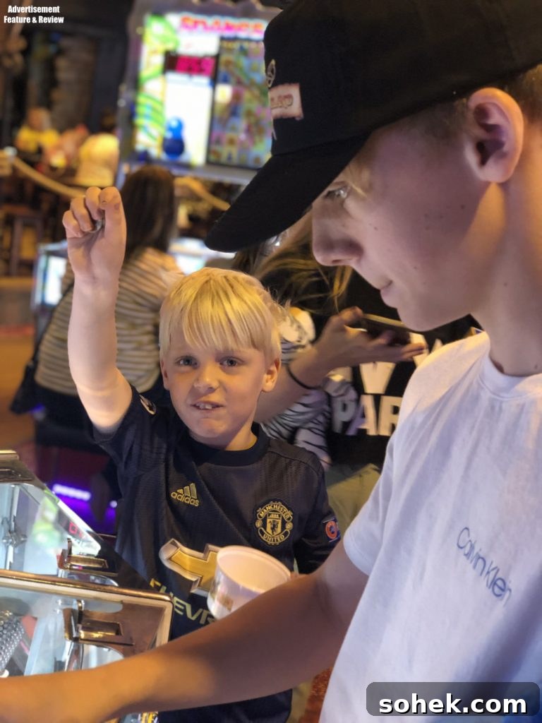 Playing on the 2p machines at Coral Island Blackpool