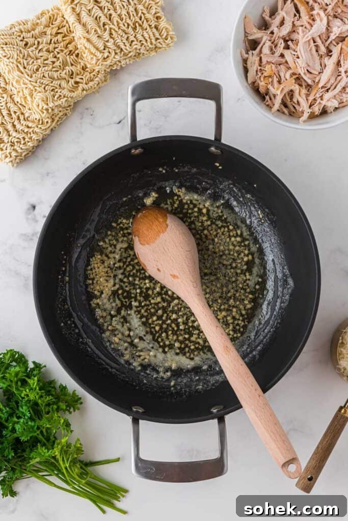 Melting butter in a skillet for garlic parmesan sauce