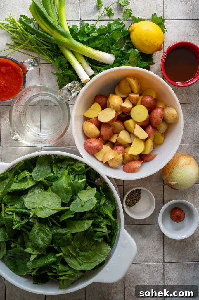 Ingredients for the spinach and potato stew, tomato sauce, water, green onions, parsley, lemon, olive oil, potatoes, salt and pepper, tomato paste, onion and spinach.