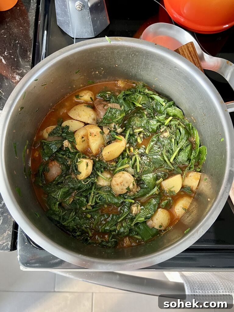 Cooking of the spinach and potato stew.