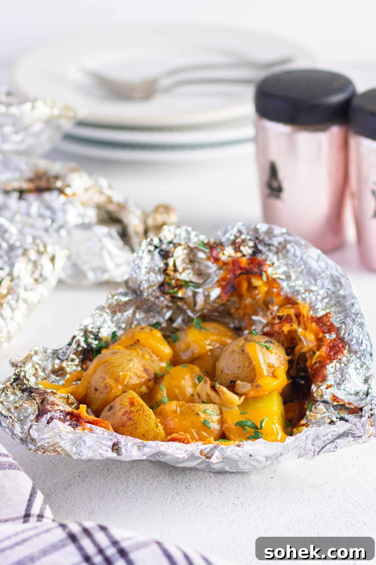 Potato packets are opened on the table ready to eat.